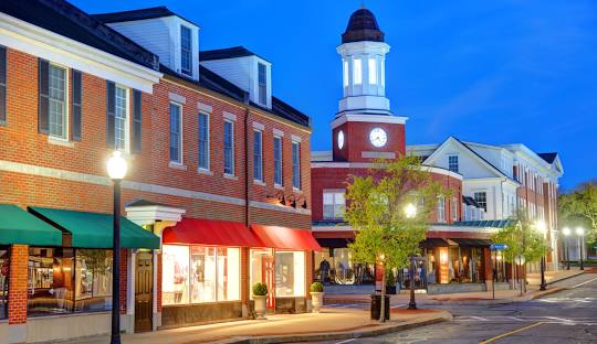Downtown street with shops and clock tower Mashpee, MA