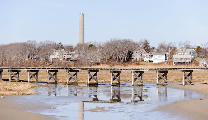 Wooden bridge over water with houses Sandwich, MA