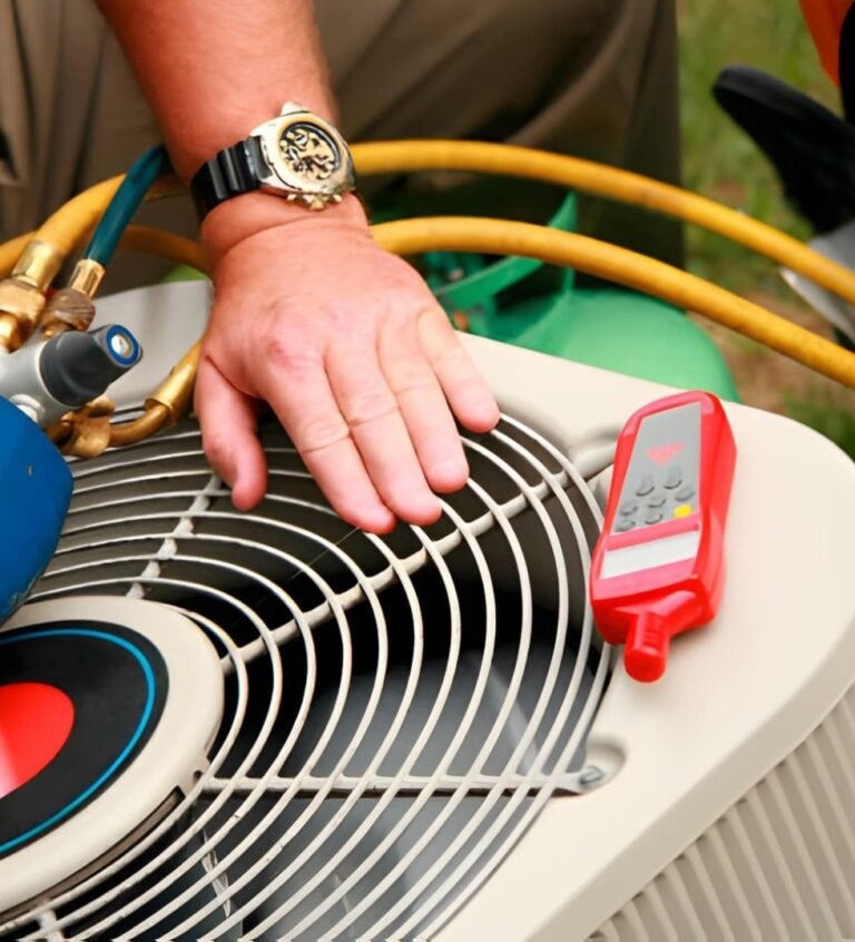 Technician repairing outdoor air conditioning unit.